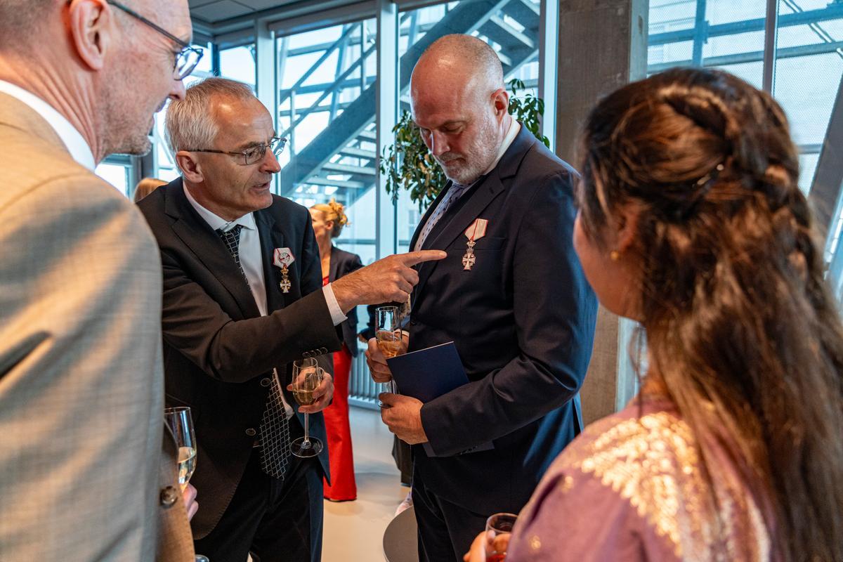 Guests came in festive attire, and several wore medals and orders
