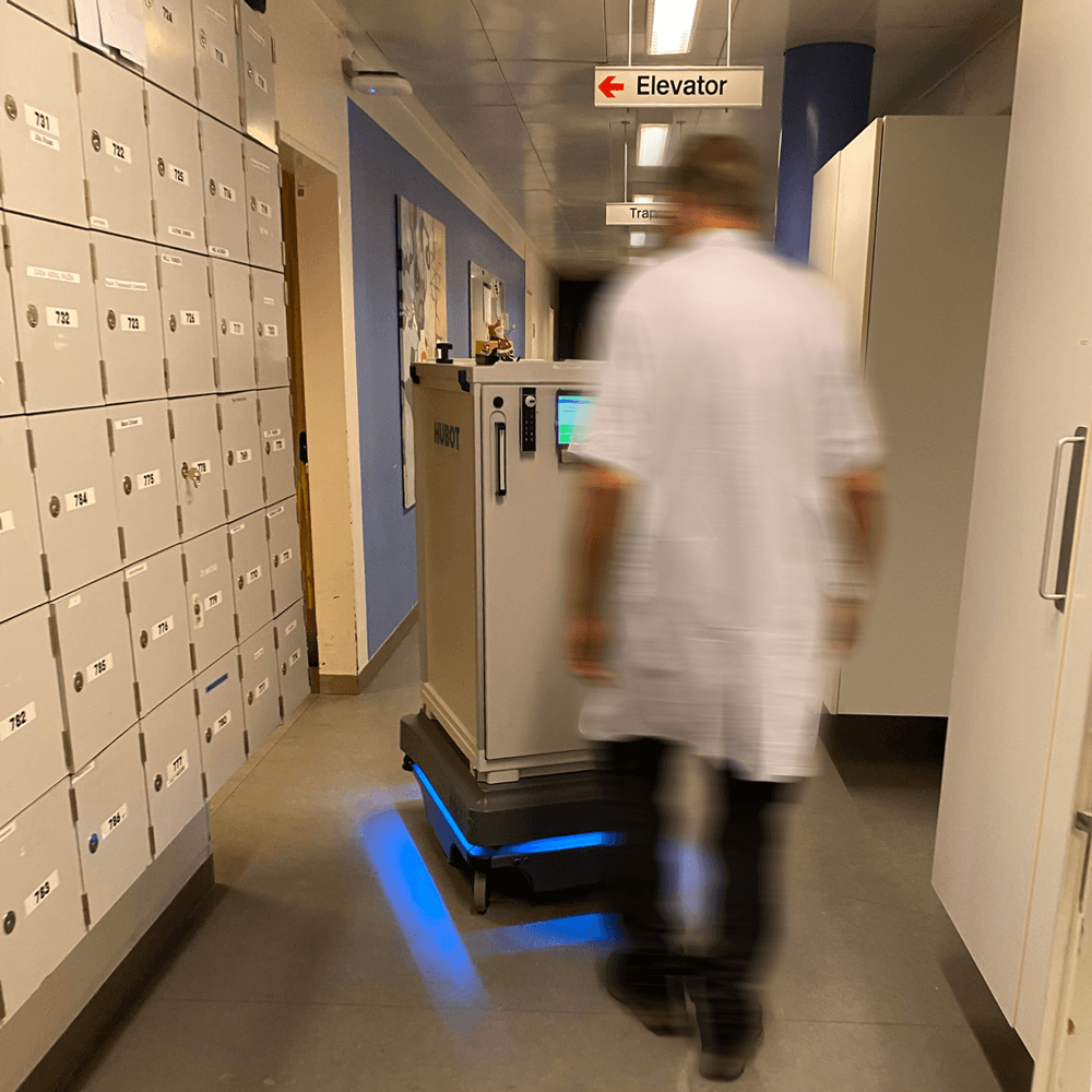 Staff have to follow the robots in the hospital